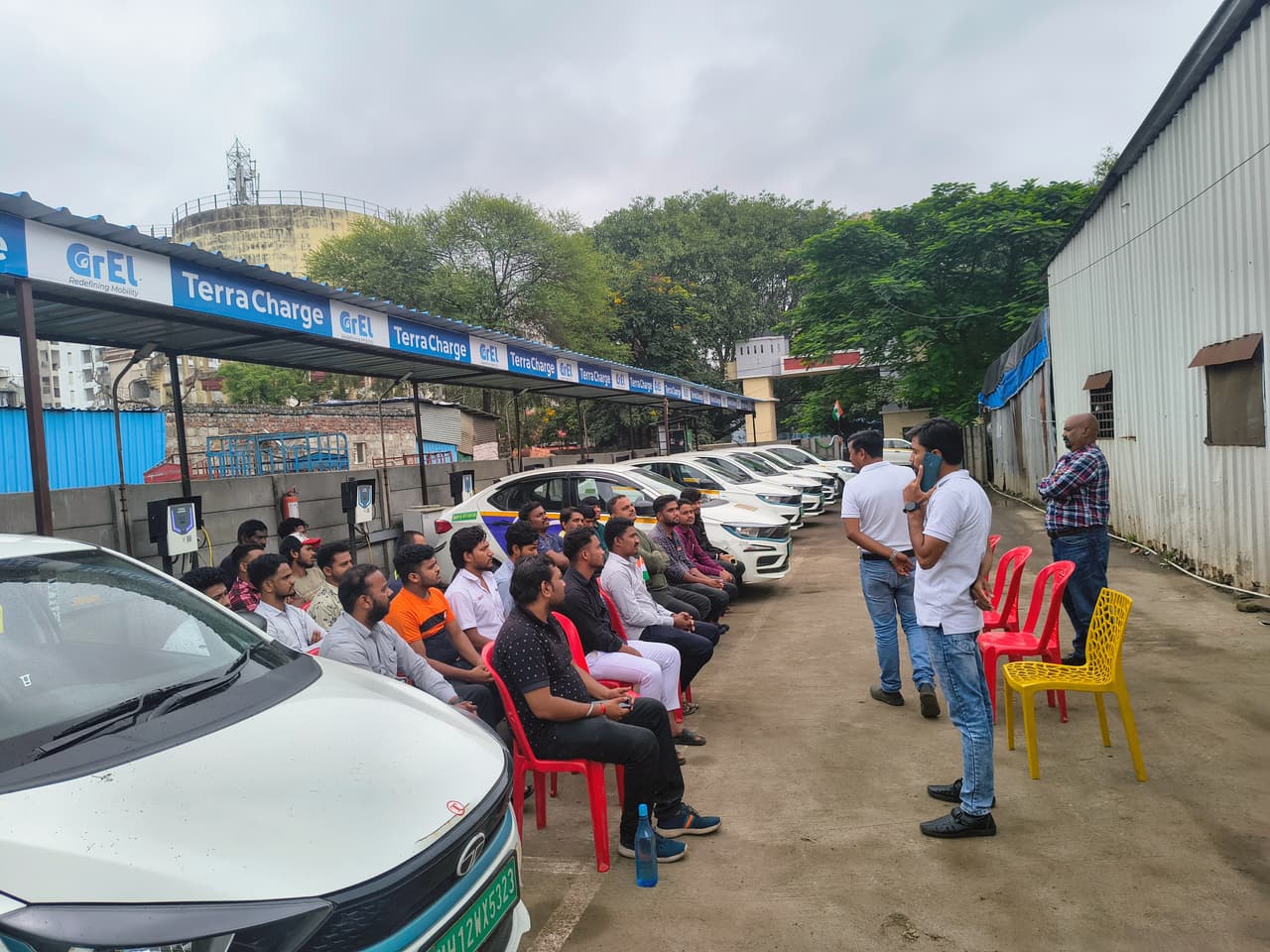 Earlier batch of GrEL drivers at outdoor training session with EV fleet