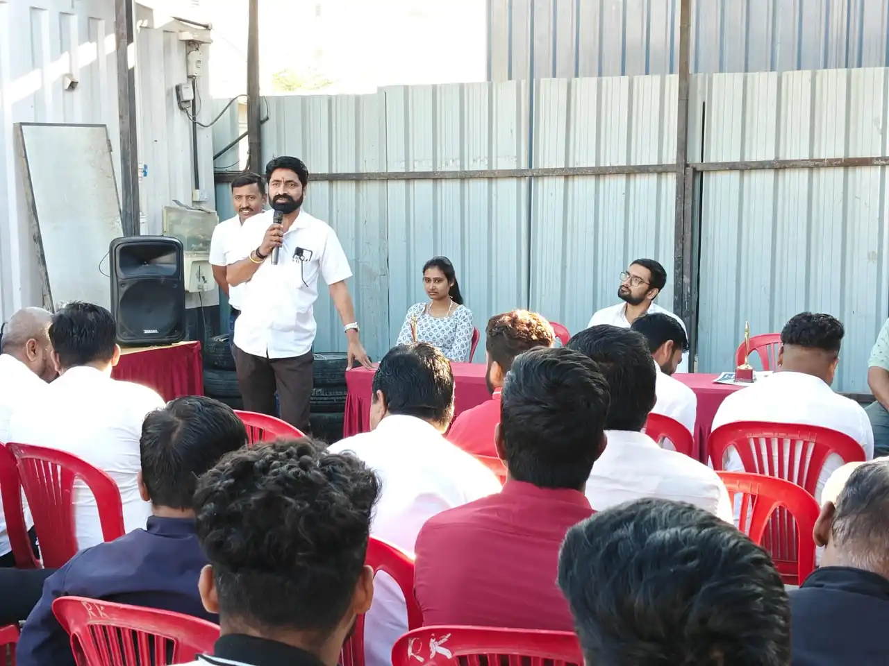Speaker addressing GrEL driver-partners during the training session
